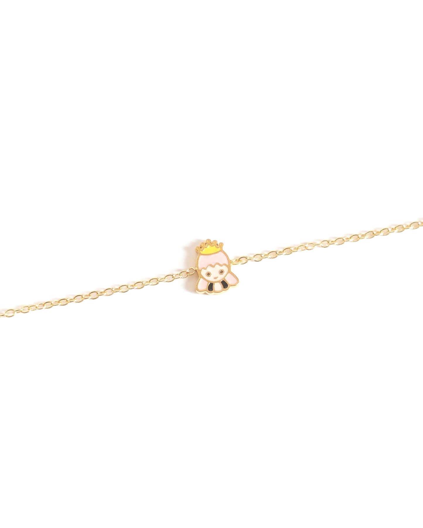 Gold bracelet with a small princess charm on a white background